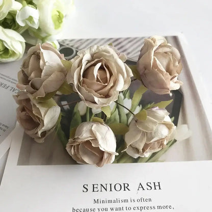 A delicate golden metallic berry stamen green plant foliage with beige fabric roses for decorbites green plant decor