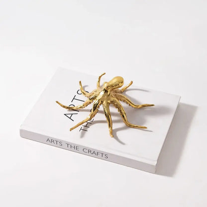 Golden octopus metal sculpture with detailed articulated limbs and polished finish for living room decorbites decor