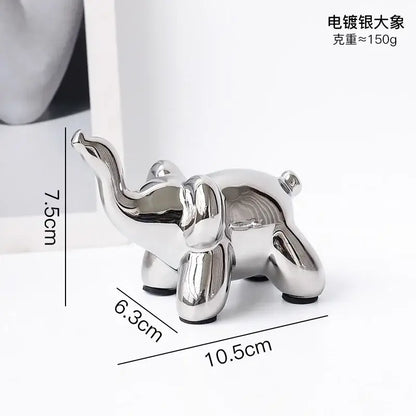 Shiny silver-plated elephant figurine with modern design and rounded contours desk ornament by decorbites golden monkey