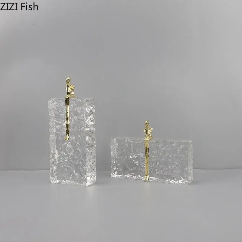 Gold figurine perched on textured transparent acrylic block golden thinker ice crystal decorbites living room sculpture