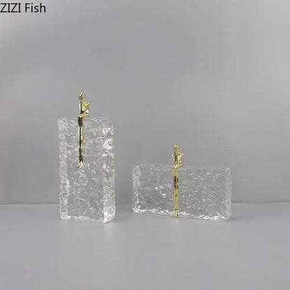 Gold figurine perched on textured transparent acrylic block golden thinker ice crystal decorbites living room sculpture