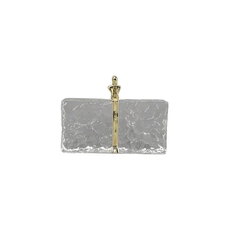 Silver rectangular clutch with hammered finish and gold-toned figurine handle for decorbites golden thinker ice crystal decor