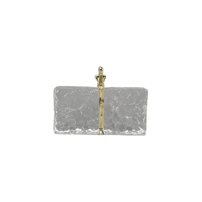 Silver rectangular clutch with hammered finish and gold-toned figurine handle for decorbites golden thinker ice crystal decor