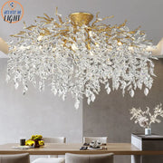 Golden tree branch crystal led ceiling chandelier with cascading clear crystal leaves in gold and black decorbites branch crystal design