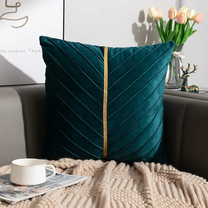 Deep teal velvet cushion cover with central gold trim and diagonal pleats in decorbites golden velvet patchwork set