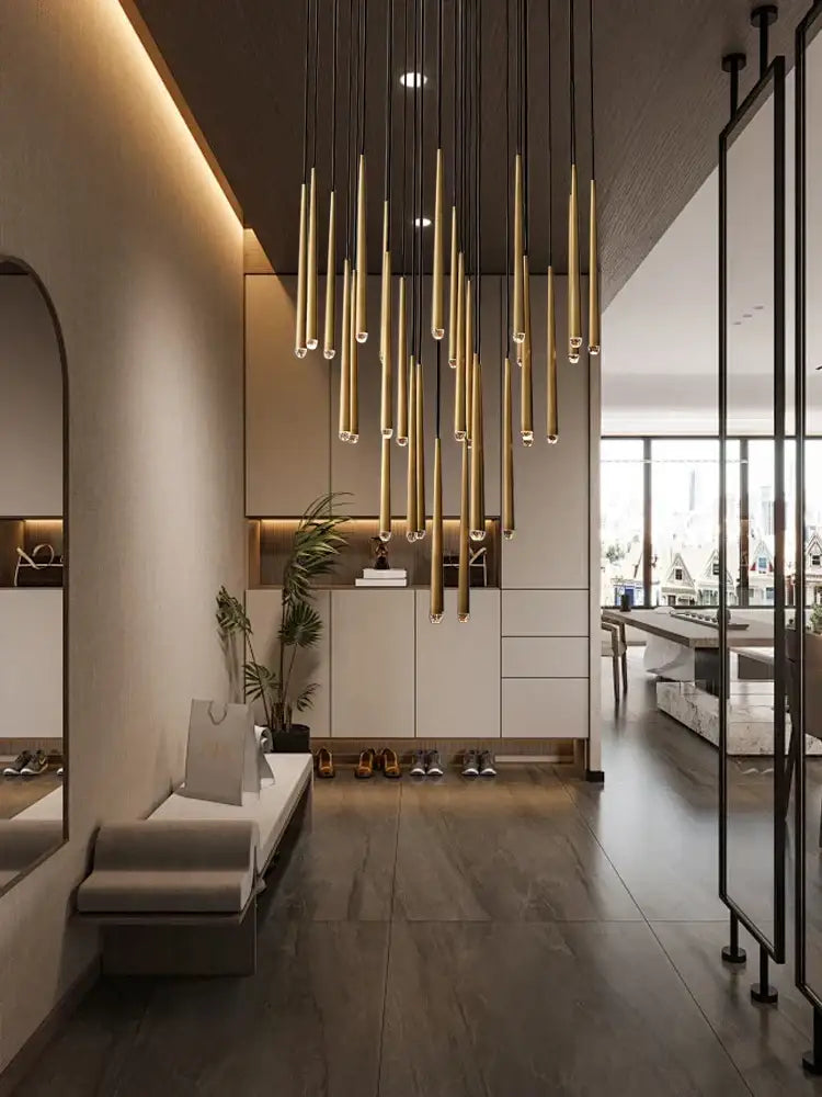 A modern golden water drop ceiling chandelier with slender cylindrical rods for living room decorbites crystal water drop lighting