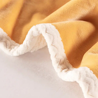 Soft mustard-yellow double-layer velvet sofa blanket with plush white sherpa trim for bedroom throw use