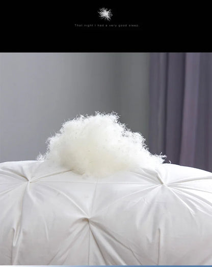 White fluffy goose down soft duvet with a tuft of down material on top for luxury warmth and comfort
