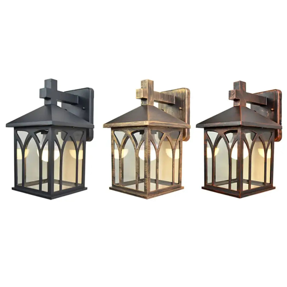 Three gothic arched glass led wall lamps with cross-topped roofs in black bronze and copper finishes for outdoor use