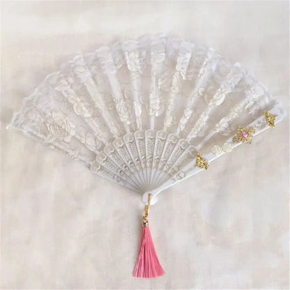 Elegant white lace fan with gold embellishments and pink tassel featuring decorbites elegant gemstone handle for party decor