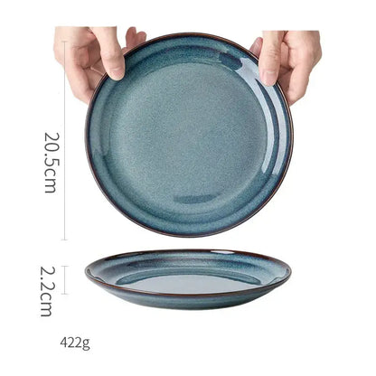 A sleek glazed ceramic bowl with gradient blue finish gold rim dinnerware dish for elegant dining room use
