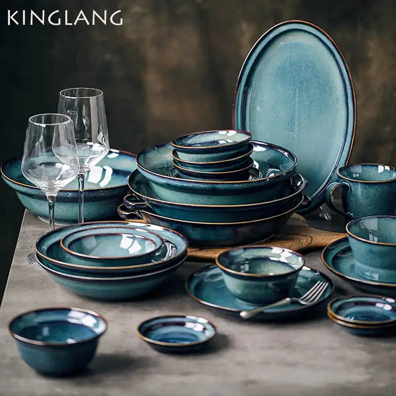 Teal ceramic bowl dinnerware dish featuring a beautiful blue ceramic glaze with gold-rimmed edges for dining