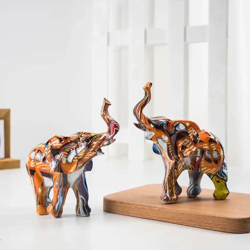 Two vibrant graffiti colorful elephant resin figurines with glossy orange and multicolored patterns for living room decorbites decor