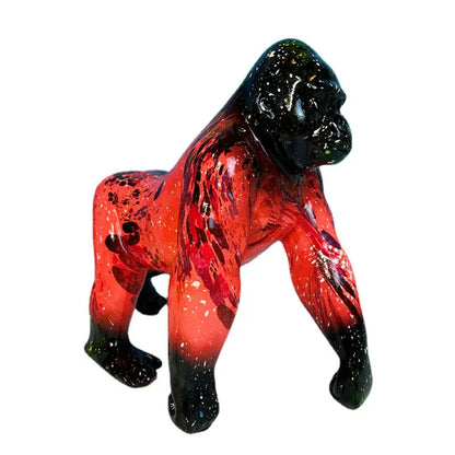 Glossy resin decorbites gorilla sculpture with vibrant red speckled body and solid black head and feet for living room decor