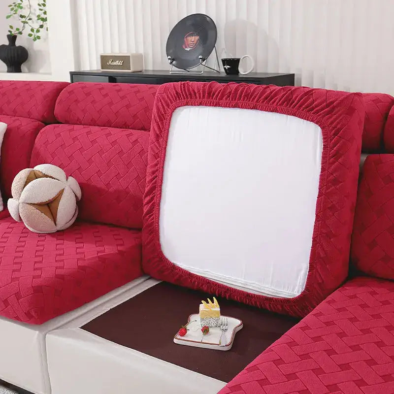 Red quilted fabric sofa cover with white central panel and elasticated edges for gray and white woven elastic sofa slipcover