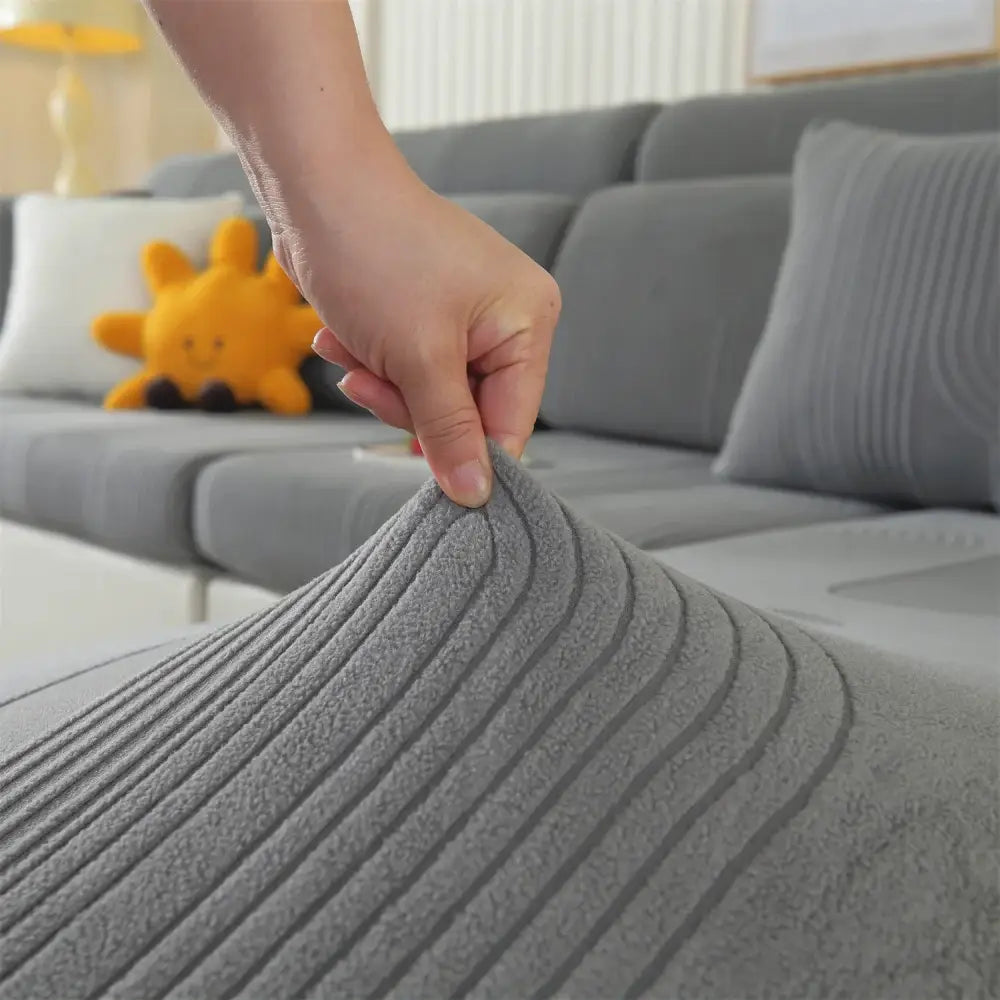 Gray circular textured polar fleece sofa cover with soft ribbed fabric for modular sofas and accent chairs living room use