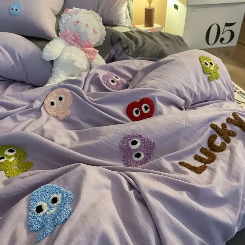 Lavender-colored plush comforter with colorful fuzzy embroidered cartoon faces and lucky in brown yarn from gray cotton cartoon towel bedding set decorbites cotton cartoon