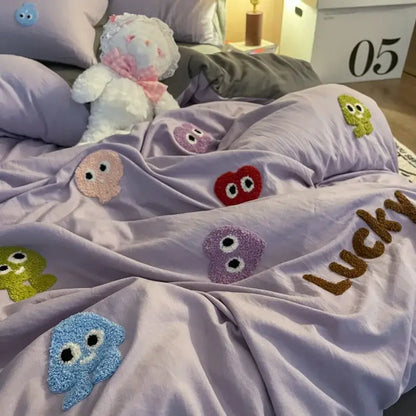 Lavender-colored plush comforter with colorful fuzzy embroidered cartoon faces and lucky in brown yarn from gray cotton cartoon towel bedding set decorbites cotton cartoon