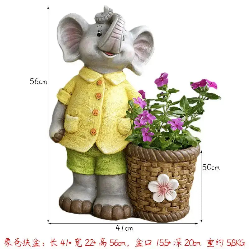Gray ceramic elephant garden decoration dressed in yellow jacket holding basket planter with purple flowers