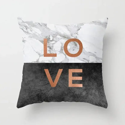 Square throw pillow case with gray marble top half black agate textured bottom half and rose gold love lettering