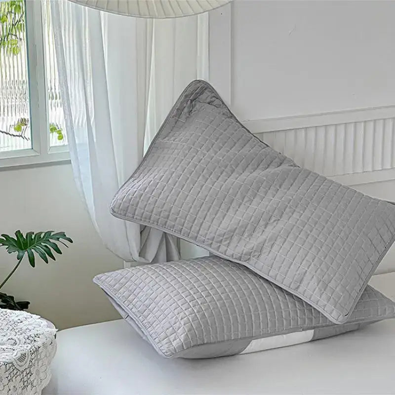Gray quilted cotton pillowcase shield with subtle grid pattern made of soft decorbites cotton fabric for bedroom sweat protection