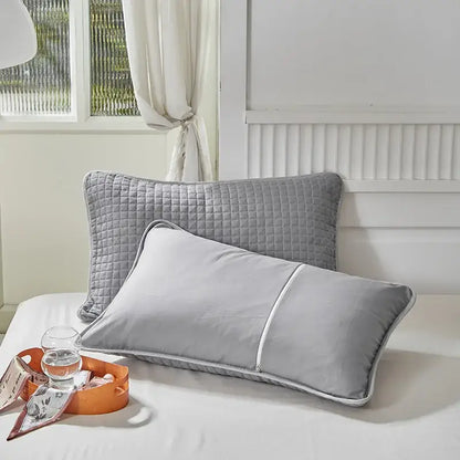 Gray quilted cotton pillowcase shield with subtle diamond pattern and white piping for bedroom sweat protection by decorbites cotton