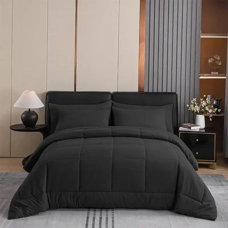 Black king size quilted comforter with soft plush texture and subtle stitching for bedroom use