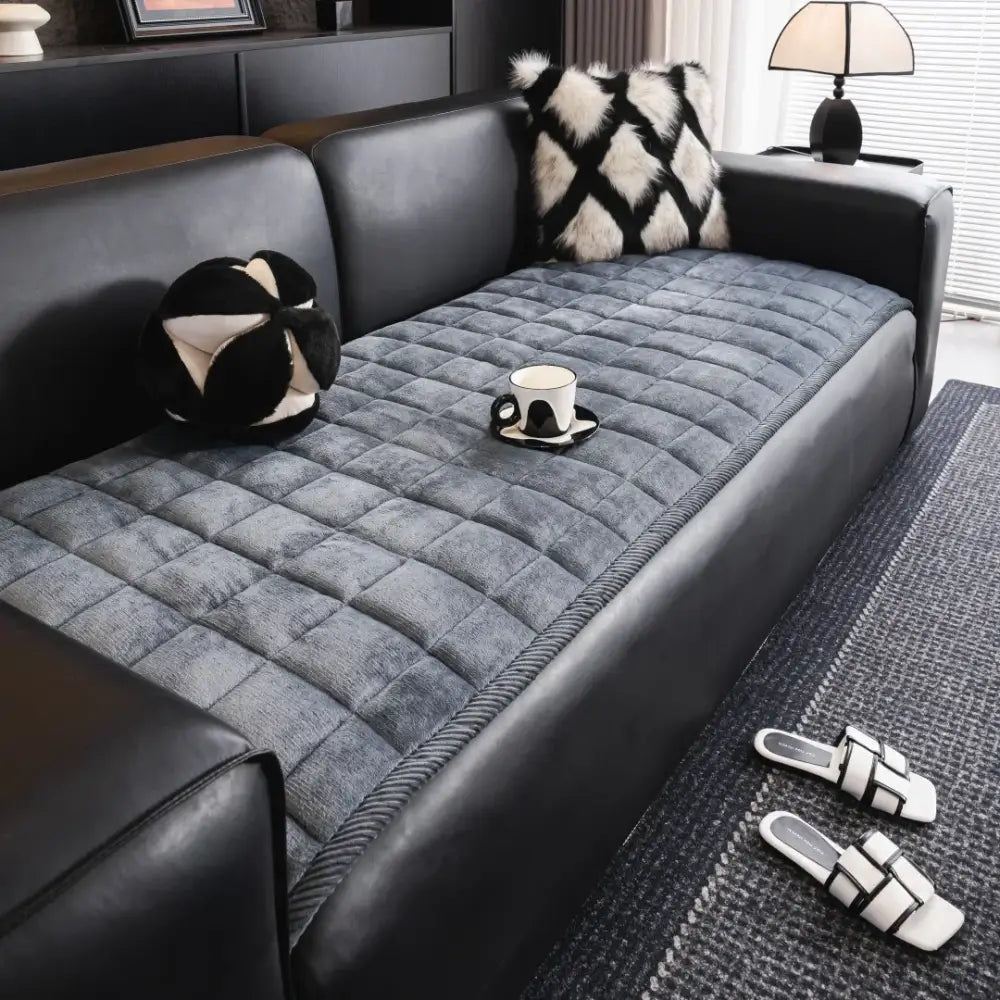 Gray quilted square sofa towel cushion pad with soft plush texture and stitched diamond pattern for living room use