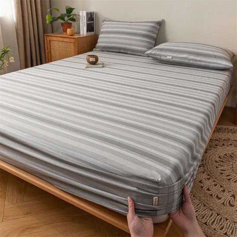 Gray red and black plaid cotton sheet set with gray striped fitted sheet featuring subtle textured weave decorbites coarse cloth