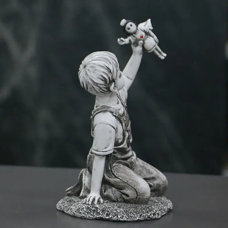 Gray resin super nurse angel boy statue kneeling with overalls holding small angel doll for living room decor