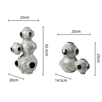 Gray speckled abstract planet ceramic ornament with silver textured spherical segments and circular openings for decorbites abstract planet decor