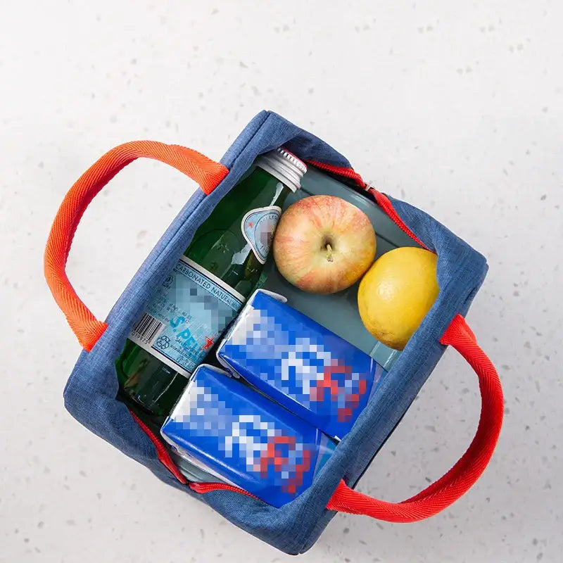 Blue denim insulated lunch bag with bright orange handles and red zipper accents for thermal food storage