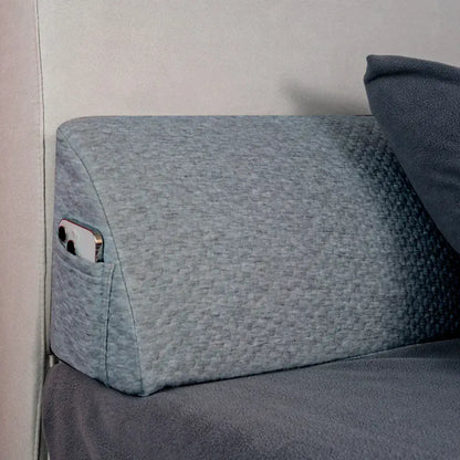 Gray textured memory foam bed wedge pillow with built-in phone pocket for bedroom mattress gap filler use