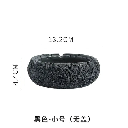 Black lava rock small ashtray without lid designed as a gray cement astronaut ashtray for living room use