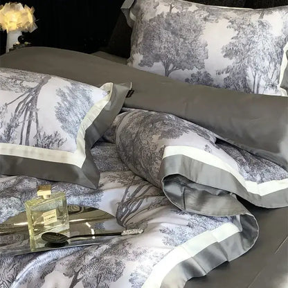 Gray and white satin bedding set with forest toile jungle print flowers and elegant contrasting trim by decorbites