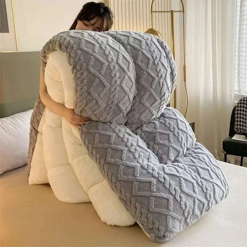 A plush gray and white quilted cushion with a textured diamond pattern for decorbites cozy winter bed blanket use