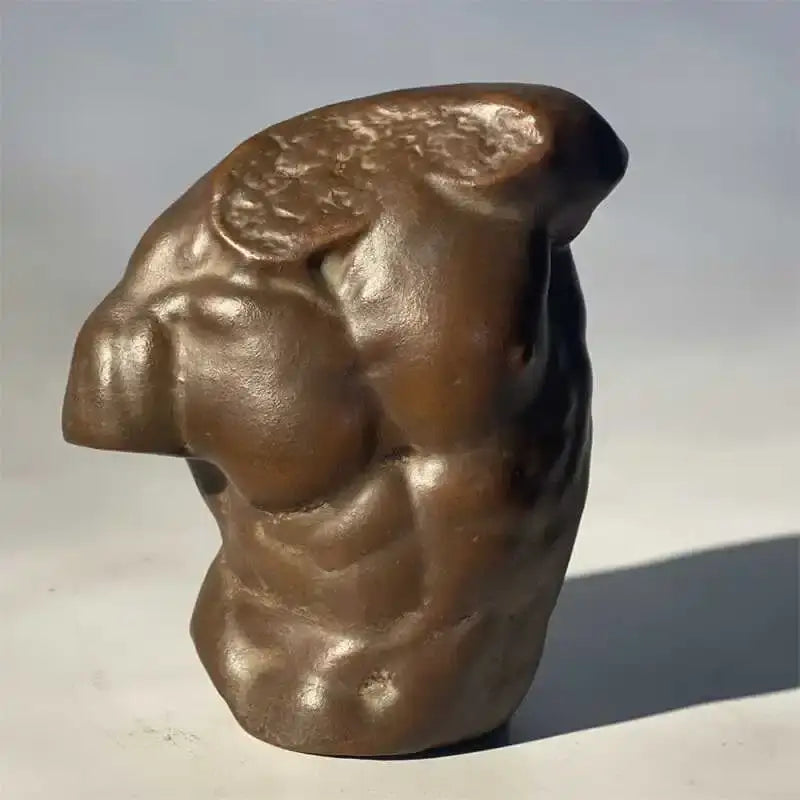 Bronze-colored greek nude human figure bust sculpture with muscular torso and textured surface for living room decor
