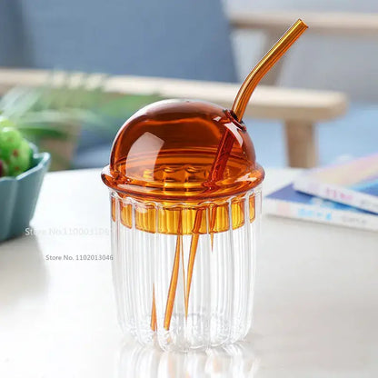 Green decorbites 450ml striped glass cup with clear ridges, amber translucent dome lid, and matching curved straw