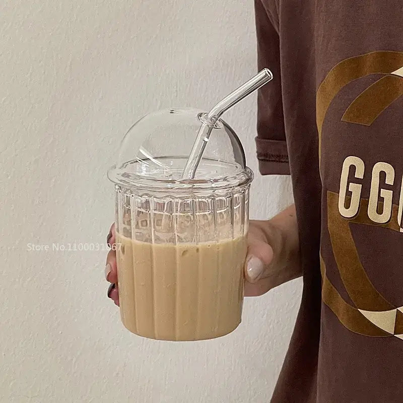 Clear glass cup with ribbed texture and dome lid holding iced coffee decorbites 450ml striped glass cup