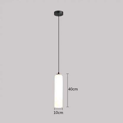 Minimalist black pendant light with frosted glass cylinder diffuser and matte metal hardware for green glass nordic decor