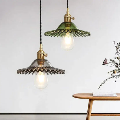 Green and clear glass pendant light with brass fixtures featuring decorbites copper base glass for dining room decor