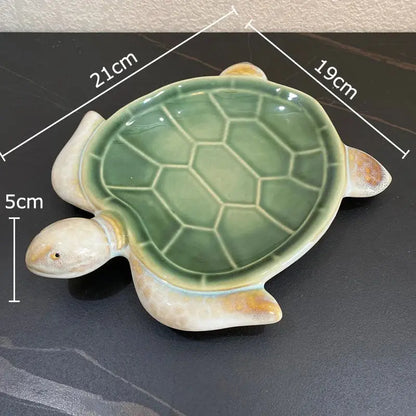 Green and cream ceramic cute turtle statue tray with glossy shell and yellow accents for living room decor