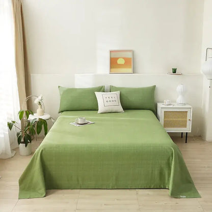 A soft sage green woven bedspread featured in decorbites cartoon printed cotton bedspread for bedroom decor