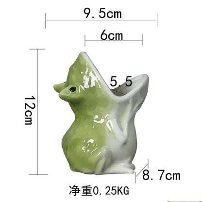 Glossy green and white ceramic flower pot shaped like a sitting duck with open beak for decorbites cute frog succulent