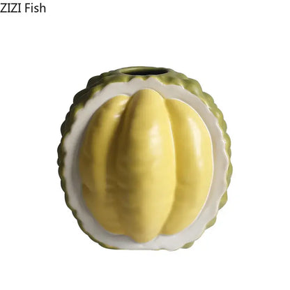 Green and yellow durian ceramic vase shaped like sliced durian with vibrant flesh and outer husk for table decor