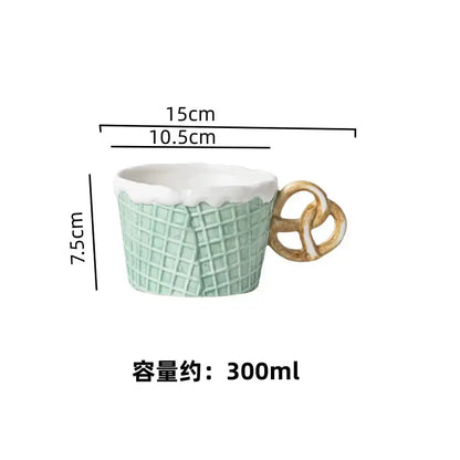 A mint green creative biscuit ceramic mug with white waffle rim and pretzel handle from decorbites biscuit ceramic tableware