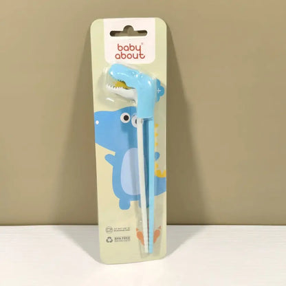 Light blue dinosaur-shaped baby feeding utensils in baby about package for kids training with decorbites dino chopsticks
