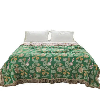 Green floral cotton tassel sofa blanket with beige botanical patterns and textured fringe for living room decorbites cotton tassel