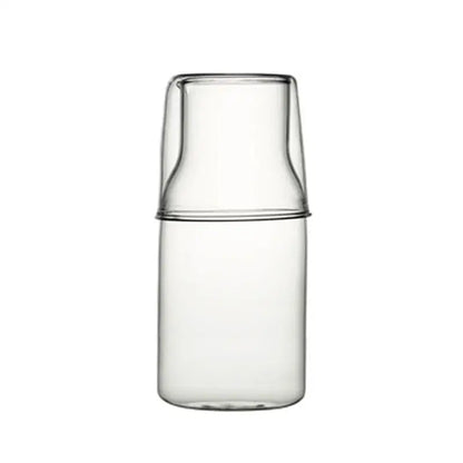 Clear glass 550ml bedside water carafe with matching lid and minimalist design for bedroom use