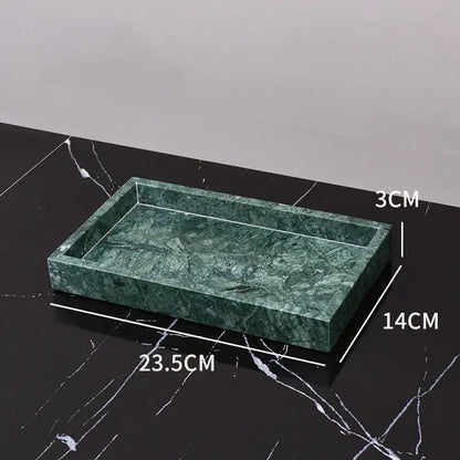 A rectangular green marble bathroom tray with polished veined surface and raised edges from a marble bathroom set